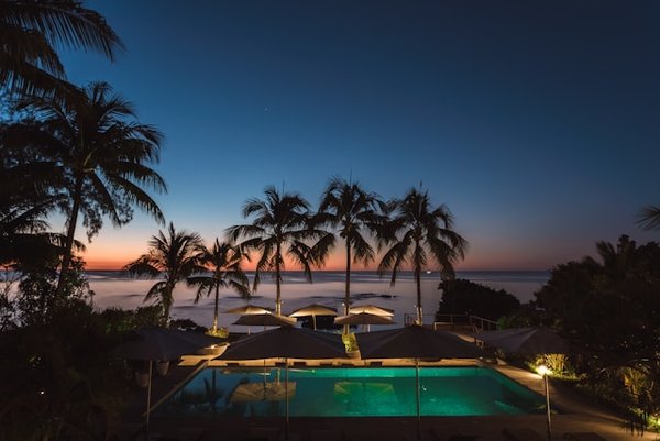 What are the specific requirements for installing a heat exchanger in a UK home swimming pool?